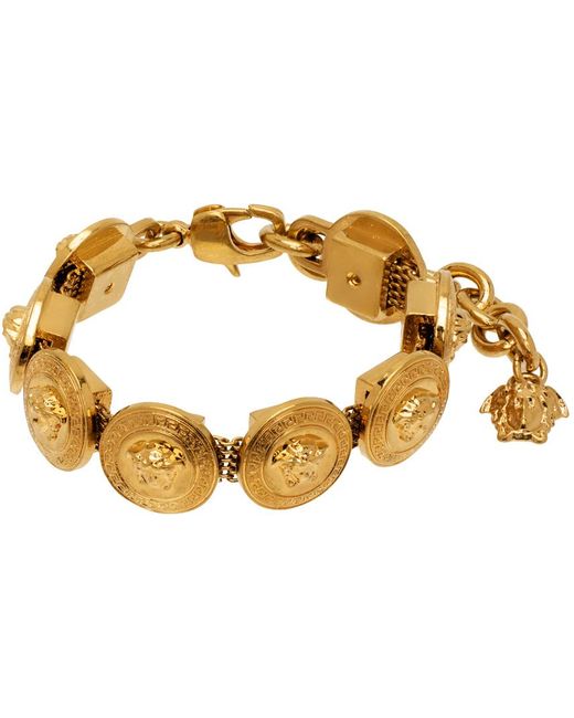Bracelet doré à médaillons tribute et à breloque à méduse Versace en coloris Metallic