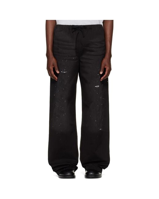 Acne Black Paint Splatter Drawstring Trousers for men