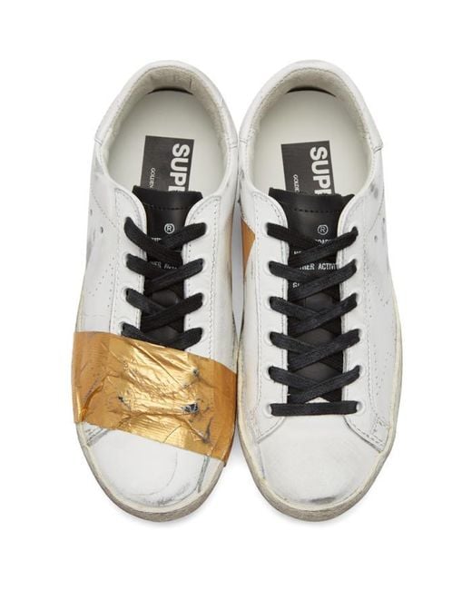 Golden goose deluxe brand White & Gold Tape Skate Superstar Sneakers in