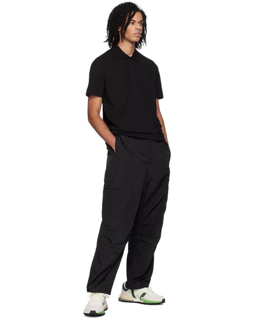 Pantalon hydrofuge noir Lacoste pour homme en coloris Black