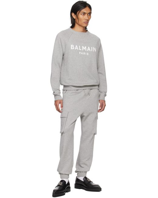 Pull molletonné gris à logo imprimé Balmain pour homme en coloris Gray