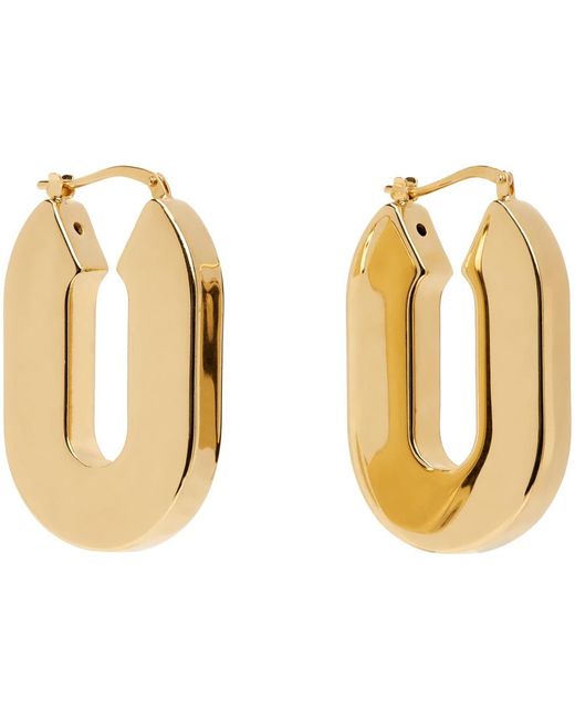 Boucles d'oreilles à anneau dorées Jil Sander en coloris Black