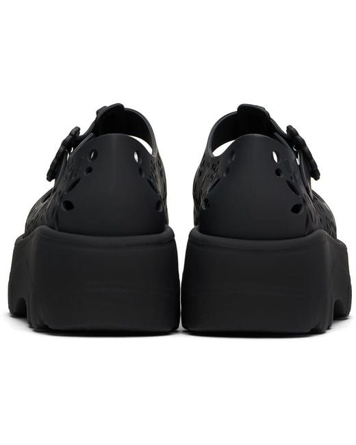 Chaussures oxford kick off noires à découpes Melissa en coloris Black