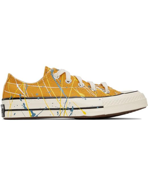 yellow converse with stripes inside