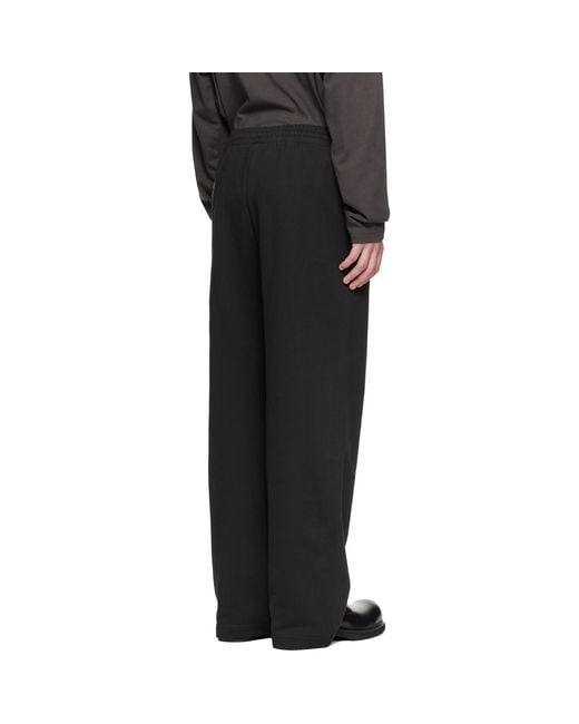we11done Black Chain Embroidered Sweatpants for men