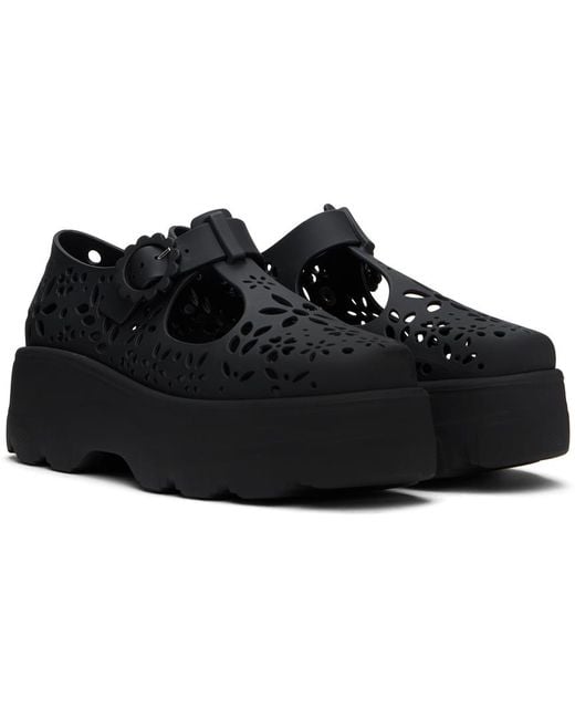 Chaussures oxford kick off noires à découpes Melissa en coloris Black