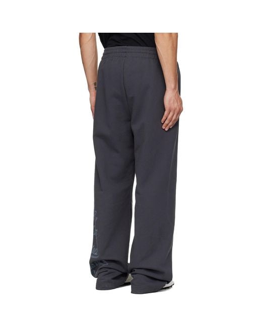 we11done Blue Multi-Logo Sweatpants for men