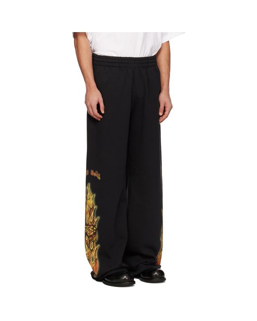 we11done Black Fire Sweatpants for men