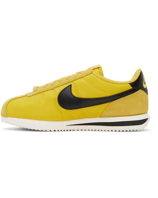 black and yellow nike cortez