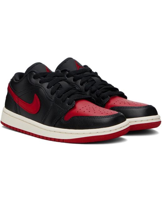 Baskets basses air jordan 1 noir et rouge Nike en coloris Black