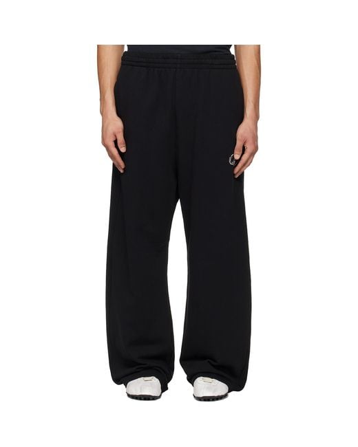 we11done Black Curved Sweatpants for men