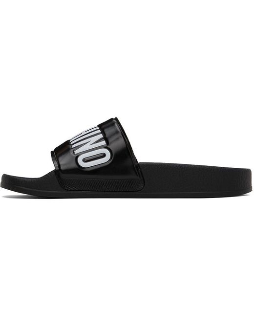 Sandales à enfiler noires en pvc à logos Moschino en coloris Black