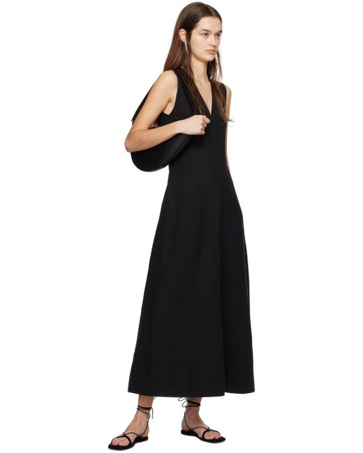 Robe longue noire à col en v Totême  en coloris Black