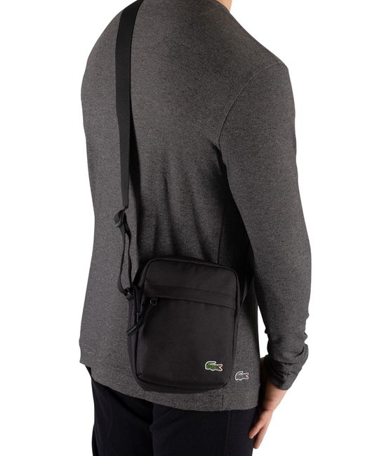 lacoste slim vertical camera bag