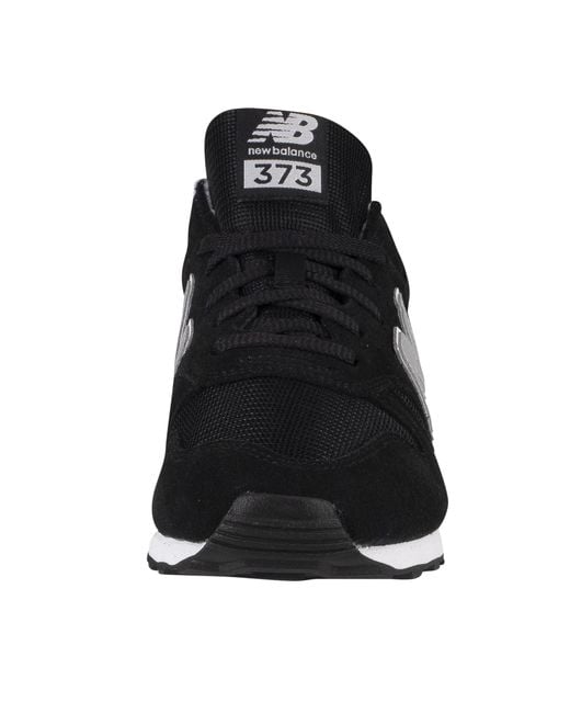 new balance black & white 373 suede trainers