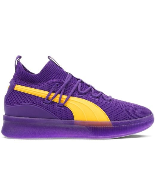 purple and gold puma shoes