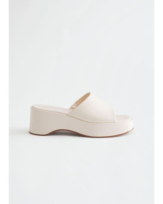 white platform slippers