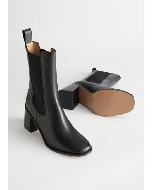 black chelsea boots with brown heel