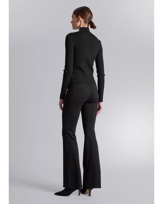 flared jersey trousers - Black
