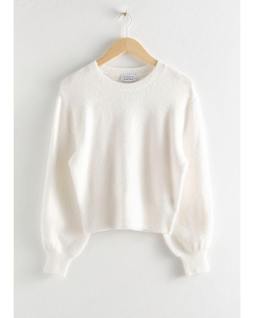 white cropped sweater