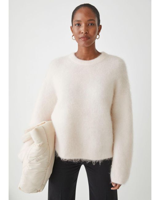 white knitwear jumper