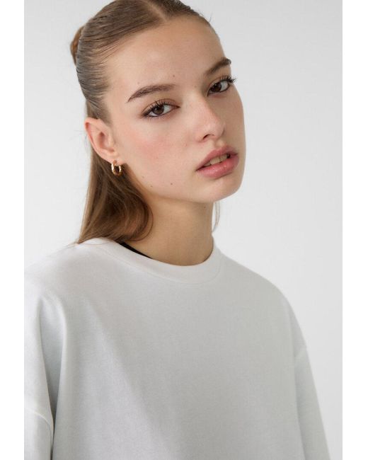 Maglietta Oversize A Maniche Corte di Stradivarius in White