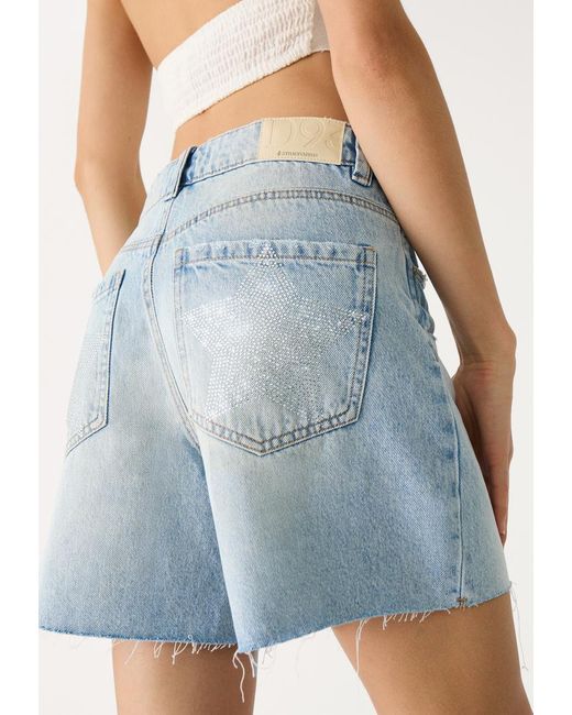 D93 Short Denim Longline Stelle di Stradivarius in Blue