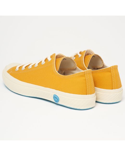 mustard yellow canvas shoes