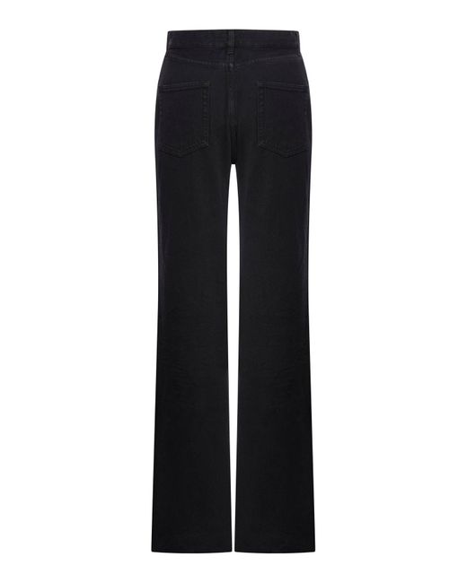 Jeans dritti e lunghi in denim fumo di Saint Laurent in Black