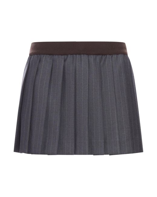 Minigonna in gessato plissÉ di Miu Miu in Gray