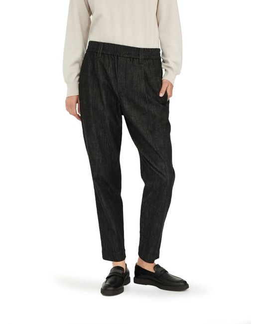 Pantalone baggy in denim dark polished con shiny loop details di Brunello Cucinelli in Black