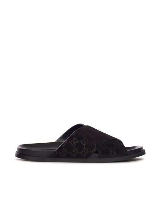 Sandali in pelle con fasce incrociate e gg allover di Gucci in Black da Uomo