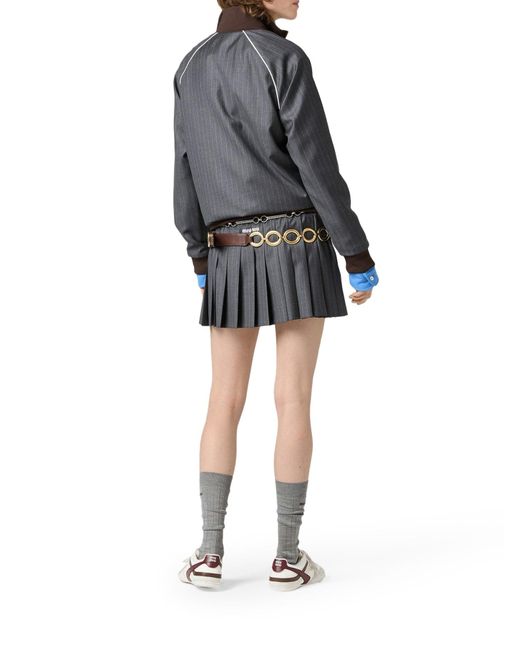 Minigonna in gessato plissÉ di Miu Miu in Gray