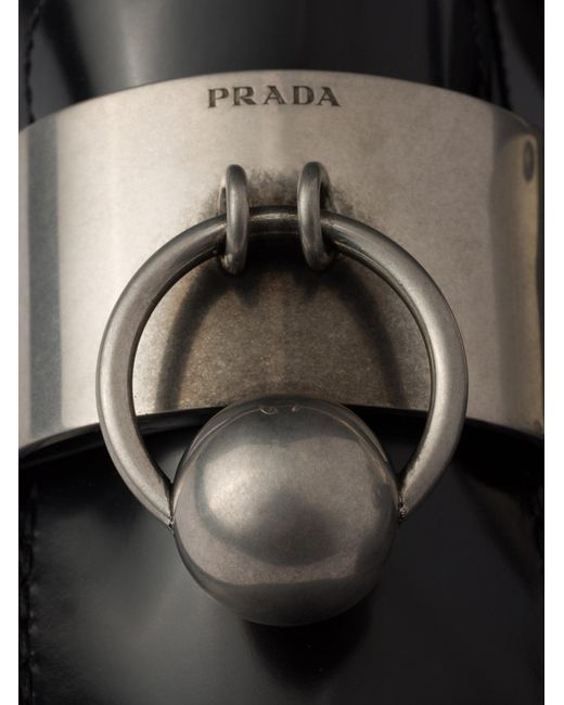 Mocassini in pelle spazzolata con anello in metallo di Prada in Black