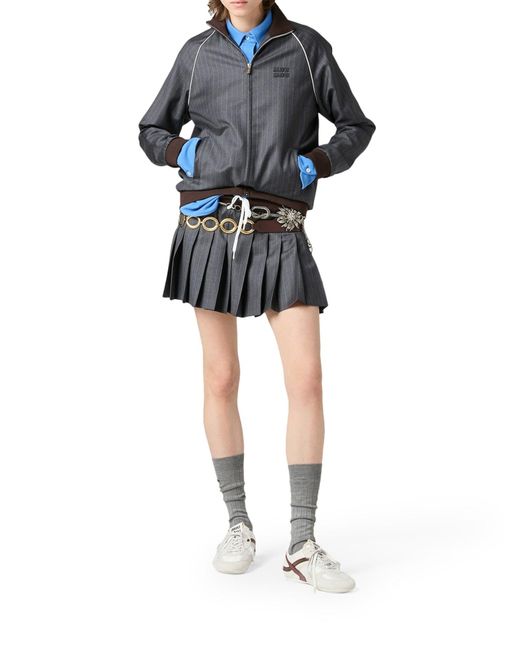 Minigonna in gessato plissÉ di Miu Miu in Gray