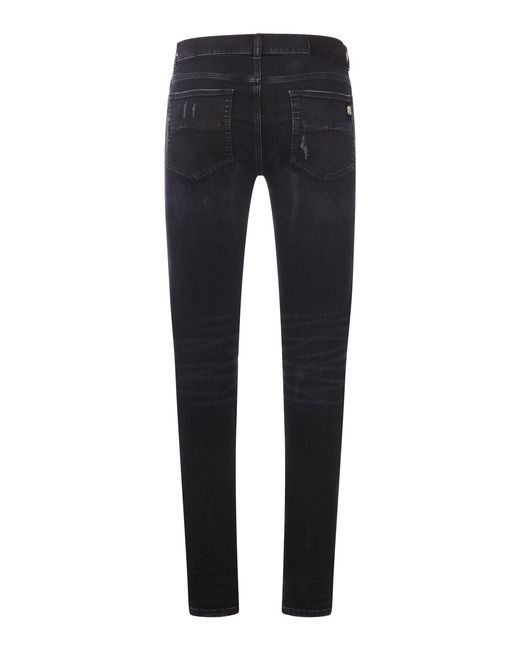 Amiri Blue Skinny Jeans With Studs And Destroy Details for men