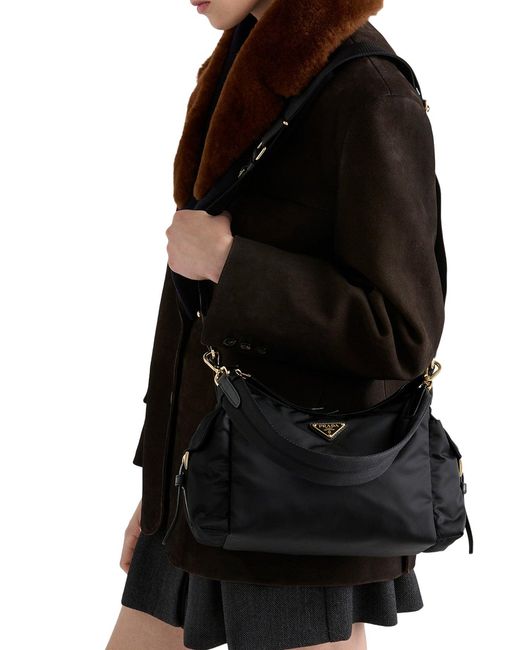 Borsa explore large in re-nylon e pelle di Prada in Black