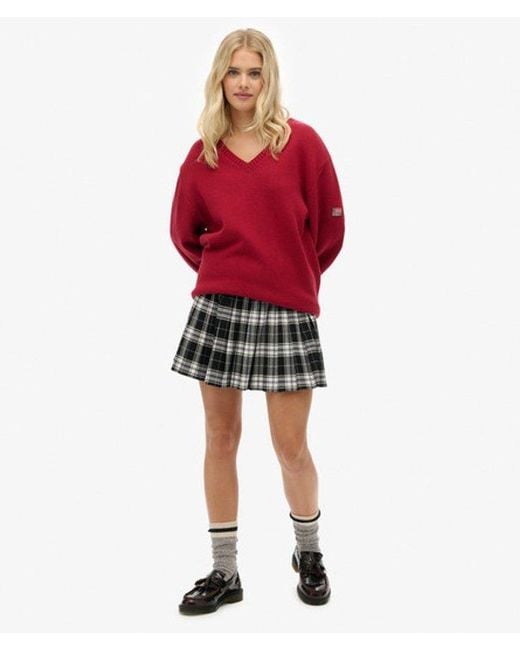 Femme Pull Col V Rayé Overtaille Taille Superdry en coloris Red