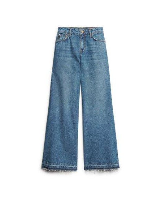 Superdry Jeans Met Uitlopende Pijpen En Onafgewerkte Zoom in het Blue