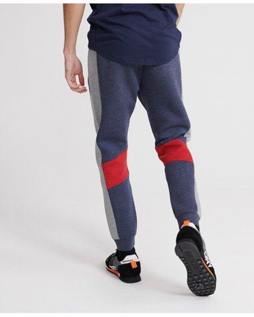 Superdry Blue Gym Tech Taped Joggers Feeder for men