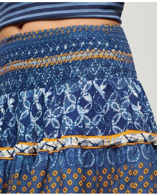 Mini-jupe froncée imprimée Superdry en coloris Blue