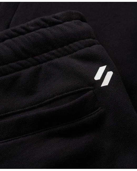 Superdry Taps Toelopende joggingbroek Met Sportswear-logo in het Black voor heren