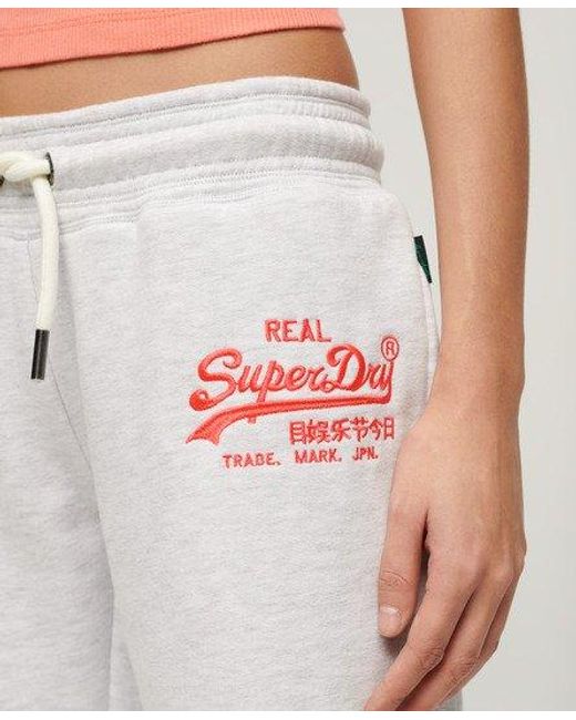 Superdry White Ladies Classic Embroidered Neon Vintage Logo Low Rise Flare joggers