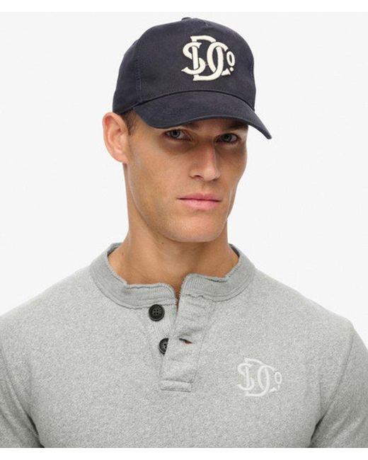 Superdry Blue & Co The Merchant Store - Monogram Trucker Cap