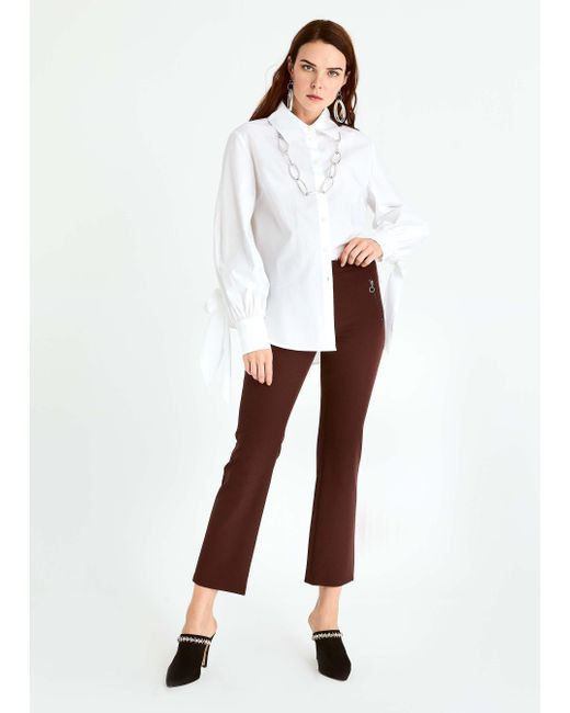 roman white trousers