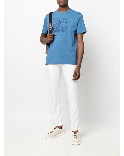 Jeans slim con logo posteriore di Emporio Armani in White da Uomo