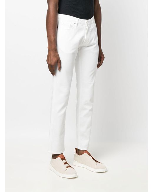 Jeans slim con logo posteriore di Emporio Armani in White da Uomo