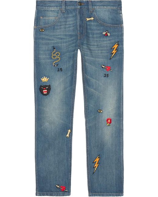 Jeans aderenti con simboli di Gucci in Blue da Uomo