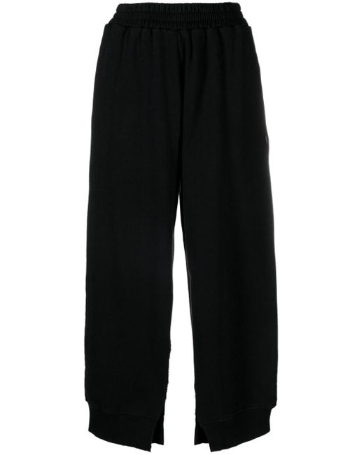 Pantaloni sportivi con spacco laterale di MM6 by Maison Martin Margiela in Black