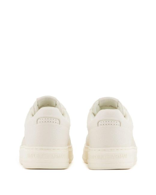 Sneakers con logo goffrato di Emporio Armani in White
